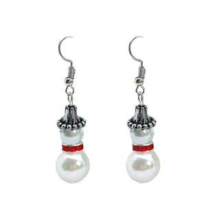 Close-up of Christmas snowman earrings with white faux pearl and red rhinestone accents