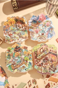 Detailed view of Chinese landscape stickers with pavilions and courtyards for journaling