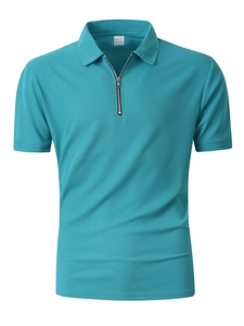 Macro shot of blue waffle textured fabric and half-zip collar on men's sports polo shirt