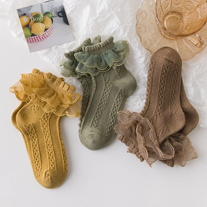 Three pairs of lace trim cotton socks for girls in yellow, green, and brown colors