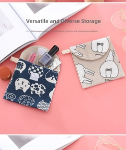 Flat lay of two compact cotton linen storage pouches with cat and alpaca cartoon patterns