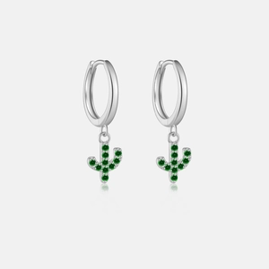 Macro detail of S925 silver cactus drop earrings with vibrant green zircon stones