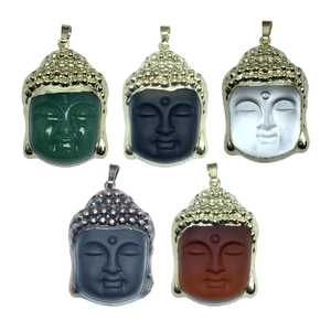 Set of five crystal Buddha head pendants with gold and bronze metal plated edges