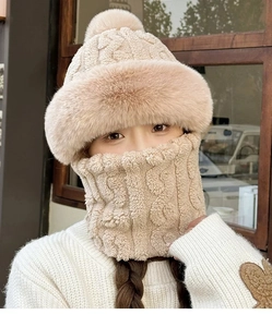 Detailed knit texture and soft plush lining of the beige winter hat and neck gaiter