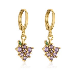 Detailed close-up of gold grape drop earrings with purple crystals and green leaf accent