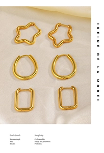 Detailed set of star, oval, and rectangular gold geometric earrings on soft beige fabric