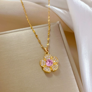 Titanium steel flower necklace with pink gem and pavé diamonds on gold chain