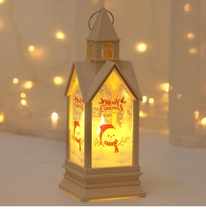 Detail of Christmas lantern with snowman motif and warm LED light in cream white