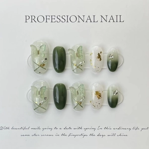 Handmade press-on nails with green butterfly 3D accents and pearl gradient design