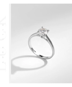 Macro shot of 1 carat moissanite ring with four-prong setting on s925 silver band