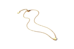 Close-up of golden heart pendant necklace with adjustable chain on white background