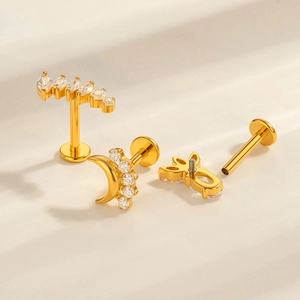 Titanium piercing jewelry set in gold finish with clear zircon moon and clover studs