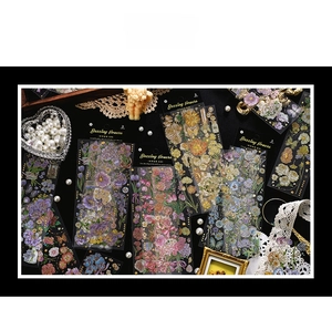 Detailed view of floral PET stickers with gold stamping and vintage ornaments