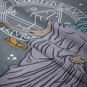 Macro close-up showing the twill fabric texture and rune symbols on the astrology tapestry