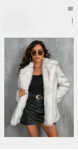 Detail of luxurious faux fur coat featuring wide collars and fluffy texture in white and grey