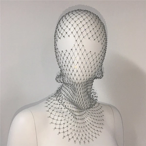 Detailed view of silver mesh headpiece with sparkling rhinestones and hollow grid pattern