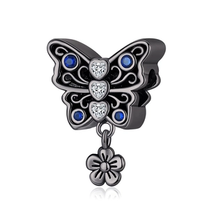 Silver butterfly pendant with blue and clear gemstones on a black metal finish