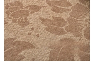 Close-up of vintage brown floral jacquard fabric texture with waterproof coating