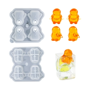 Detailed view of grey silicone penguin ice cube mold with orange-yellow penguin ice results