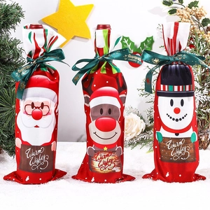 Three Christmas wine bottle covers featuring Santa, reindeer, and snowman designs