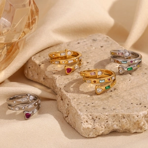 Close-up of triple-layered 18K gold plated heart rings with colorful zircon gemstones