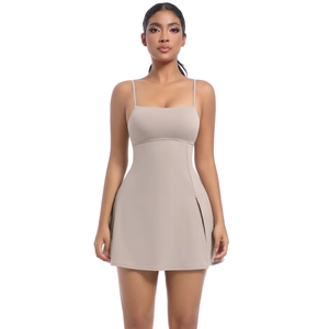 Detail of beige tennis dress with thin spaghetti straps and elegant square neckline