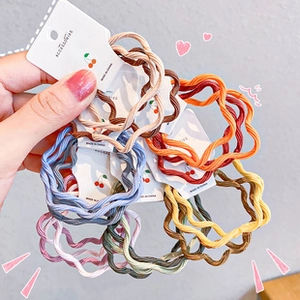 Set of colorful wave-textured elastic hair ties for kids in six vibrant summer shades