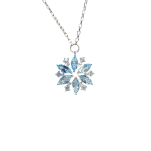 Elegant silver snowflake necklace featuring marquise blue gems and white zircon stones