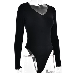 Detailed view of black long sleeve V-neck bodysuit with ribbed texture on a mannequin