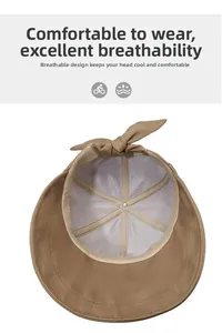 Detail view of khaki sun hat with breathable mesh lining and bow accent