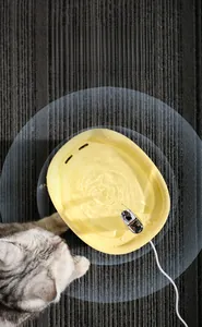 Smart pet water fountain with circular flow, showing a cat drinking on a gray carpet