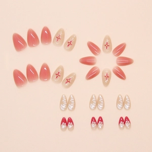 Detail of pink jelly press-on nails featuring 3D red flowers and white texture designs