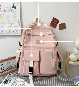 Pink multi-pocket student backpack featuring a spacious main bag and front zipper pockets