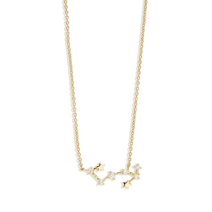 Detail of gold constellation necklace with shimmering crystals and tiny stars pendant