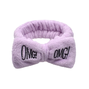 Light purple plush bow headband with OMG embroidery on a clean white background