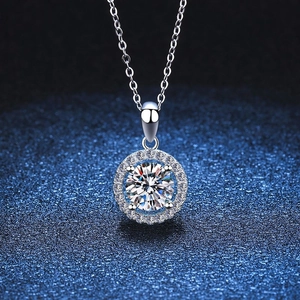 Classic 925 silver moissanite round pendant necklace with brilliant spark on blue background