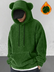Detail of green fleece hoodie showing warm bear ears on hood and soft coral velvet texture
