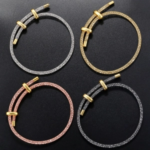 Detail view of adjustable metal mesh bracelets in silver, gold, rose gold and dark grey
