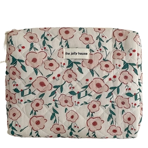 Gewatteerde cosmetische tas met roze bloemenprint en ritssluiting voor reisopslag