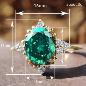 French vintage gold ring with oval emerald gemstone and diamond halo, weighing 3g