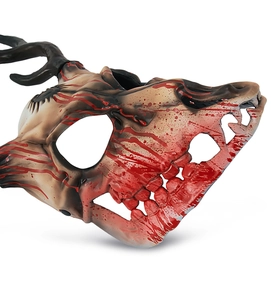 Detail view of animal bone mask with realistic red blood splatters for Halloween