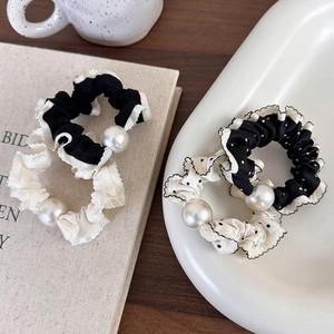 Vintage black and white polka dot scrunchie set with decorative pearls for hair styling