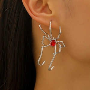 Gothic silver spider ear cuff featuring a red gemstone center for Halloween style