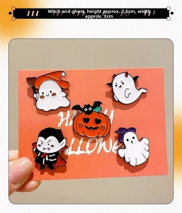Detail of 5-piece Halloween enamel pin set including ghost, pumpkin, and vampire badges