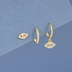 Detailed shot of S925 silver devil eye and star earrings set with blue crystals