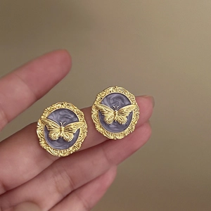 Vintage gold and purple butterfly earrings with enamel finish in royal palace style