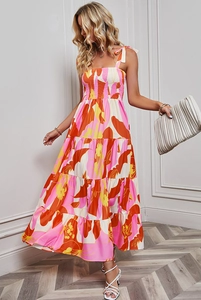Floral print summer maxi dress with tie-straps and smocked bodice detail on fabric