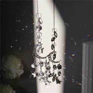 Artistic moon suncatcher with crystal star pendants creating colorful prism light effects