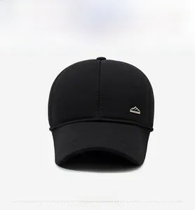 Front view of black wool baseball cap featuring a metallic mountain badge and mesh texture