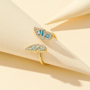 Elegant gold butterfly open ring with blue enamel and sparkling cubic zirconia stones